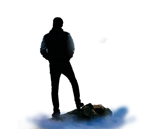 man standing on the edge of a cliff